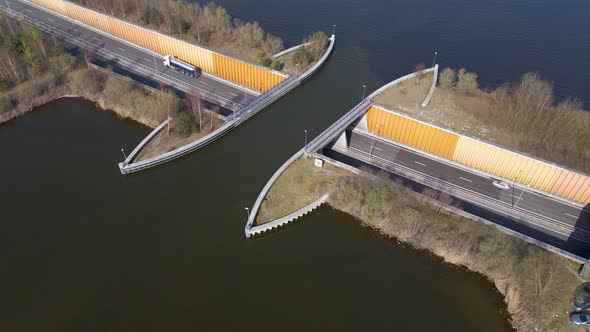 Aerial pullback from lake aquaduct Veluwemeer, transportation infrastructure project in Netherlands