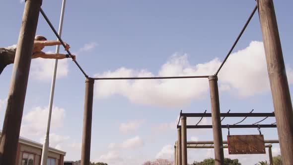 Young woman training at an outdoor gym bootcamp