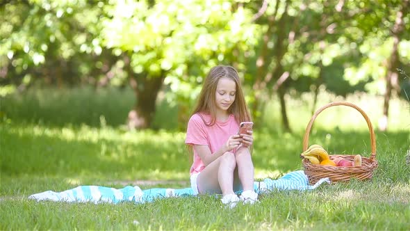 Little Girl in Yoga Position in the Park.