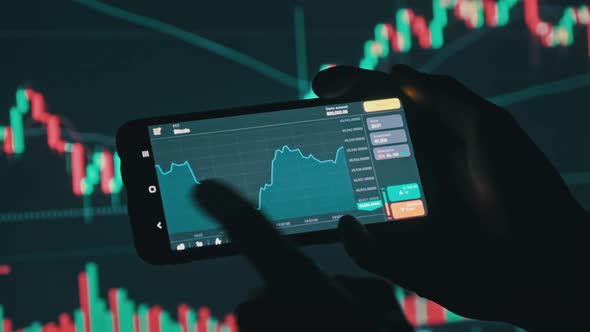 Investor Checking Bitcoin Chart on Smartphone Screen