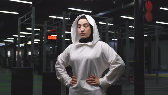 Portrait of a Muslim Woman in a Sports Hijab in the Gym