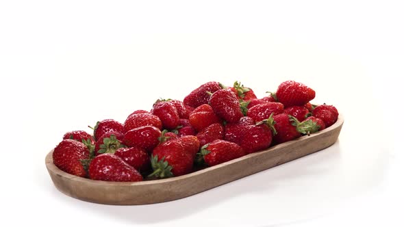 Ripe Red Beautiful Strawberry on Wooden Tray or Dish Rotate on White Background. Healthy Food