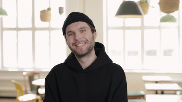 Handsome Guy Standing at Cafe and Smiling on Camera