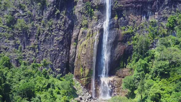 Diyaluma Falls on High Rocky Mountain in Wild Rainforest