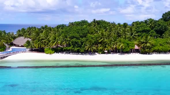 Drone view scenery of island beach voyage by clear ocean with sand background