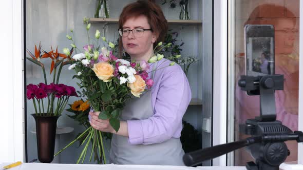 Florist blogger recording floristry video, conference calling