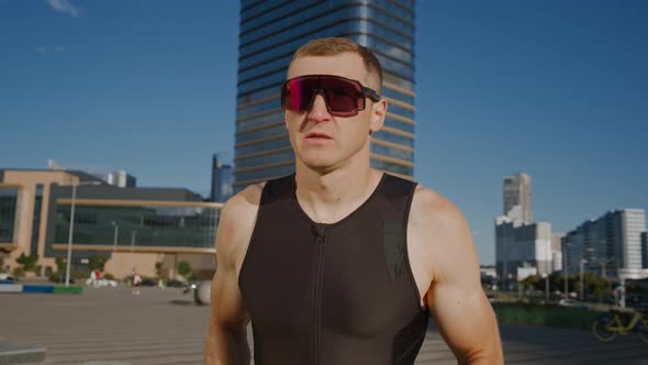 Pro Runner on a City Road Athlete Trains in an Urban Environment on a Sunny Day Modern Urban