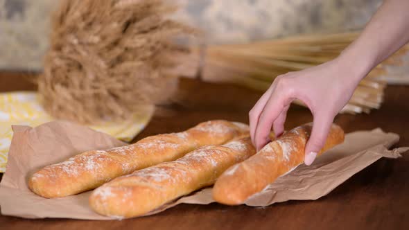 Freshly baked French baguettes on wooden table