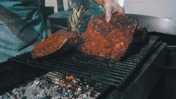 Meat Is Grilled at Street Food Festival. Large Pieces of Pork Roasted on the BBQ