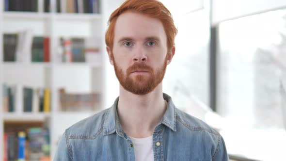 Portrait of Serious Casual Redhead Man