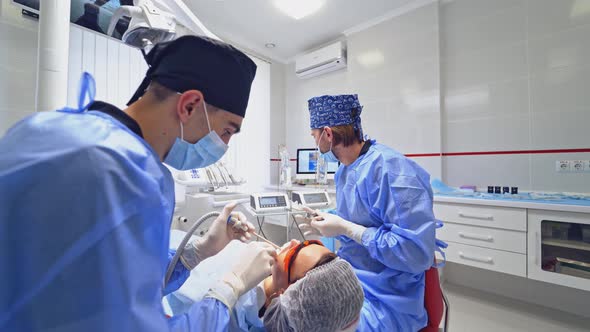 Dentists in a Modern Stomatology Cabinet