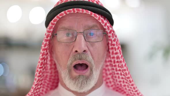 Close Up of Senior Old Arab Man Feeling Shocked at the Camera