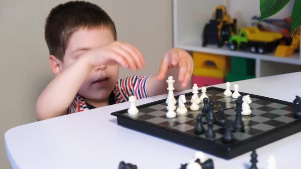 A Boy of 4 Years Old Learns to Play Chess Makes the Wrong Castling of the Tour and the King