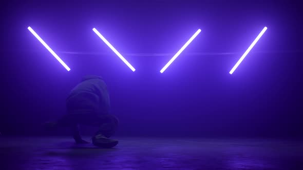 Agile Breakdancer Performing Dance on Nightclub