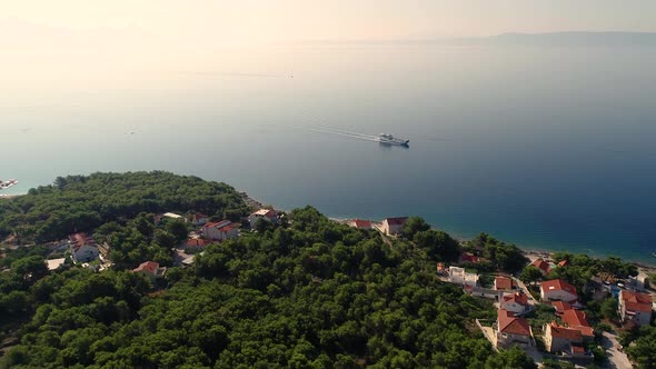 Aerial view of ferry boat approaching Sumartin port, Brac island, Croatia.