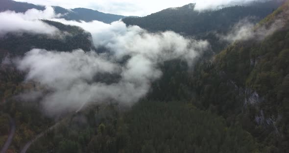 Beautiful mountains in the clouds. Aerial