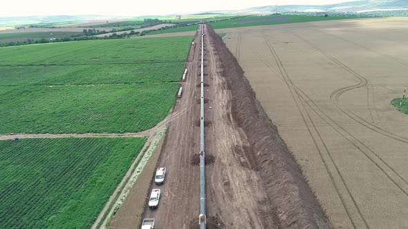 Aerial view of gas and oil pipeline construction. Pipes welded together