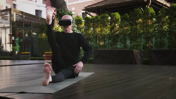 Athletic Male in VR Headset and Black Sportswear