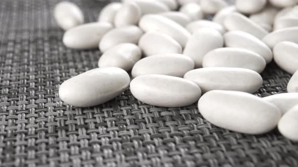 Raw white beans on a kitchen mat