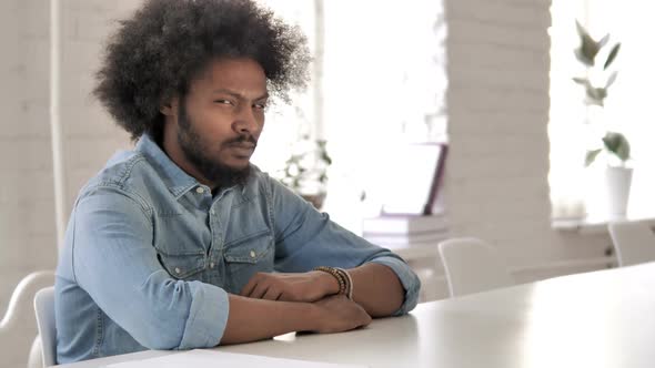 Creative African Man at Work Looking at Camera