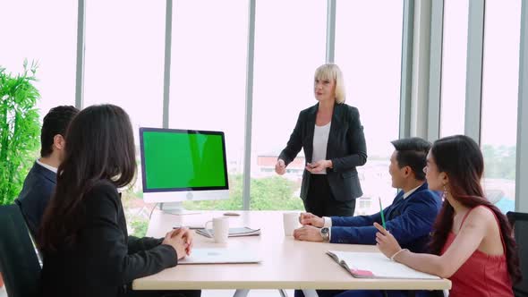 Business People in the Conference Room with Green Screen