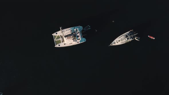 Aerial View on Anchored White Sailing Yachts, Catamarans and Boats Near Lipari Islands, Sicily