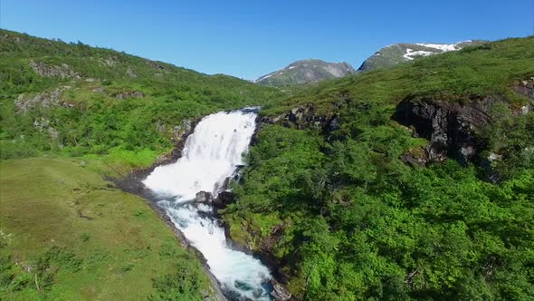 Flying above a beautiful waterfall in Norway