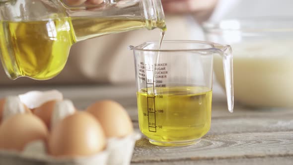 Preparing Ingredients For Dough On Sunny Morning. Measure Volume Of Butter To Be Added To Dough