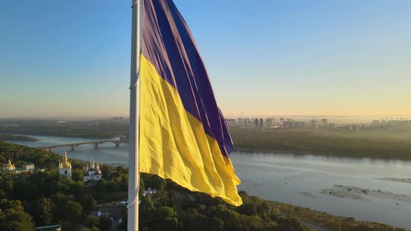 Ukrainian Flag in the Morning at Dawn. Aerial. Kyiv. Ukraine