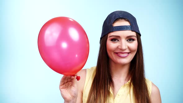 Casual Girl Playing with Balloon