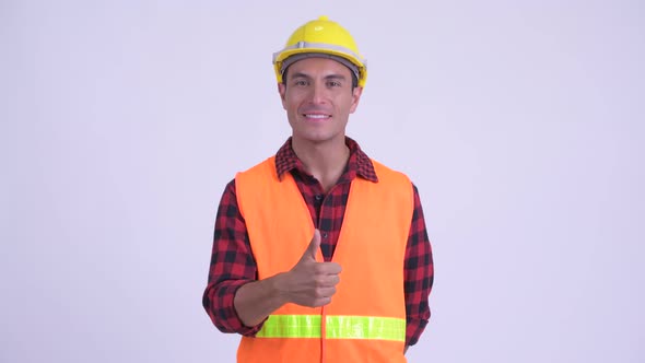 Young Happy Hispanic Man Construction Worker Giving Thumbs Up