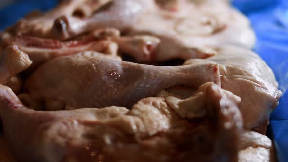 Closeup View of a Box Full of Frozen Chicken Legs