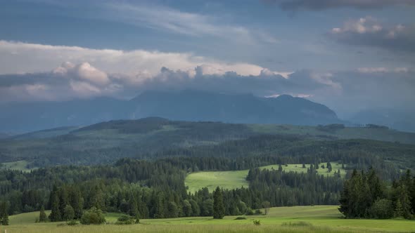 Clouds moving over Tatra Mountains at sunset, Poland, timelapse, 4K