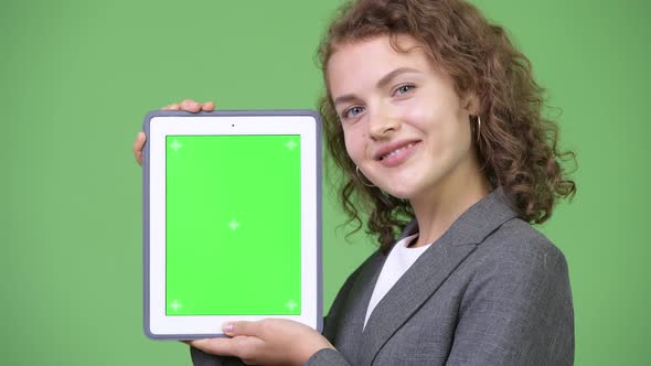Young Happy Beautiful Businesswoman Showing Digital Tablet