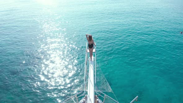 Happy Girl Stand on Bow of Sailing Boat Have Fun Discovering Islands in Tropical Sea on Summer