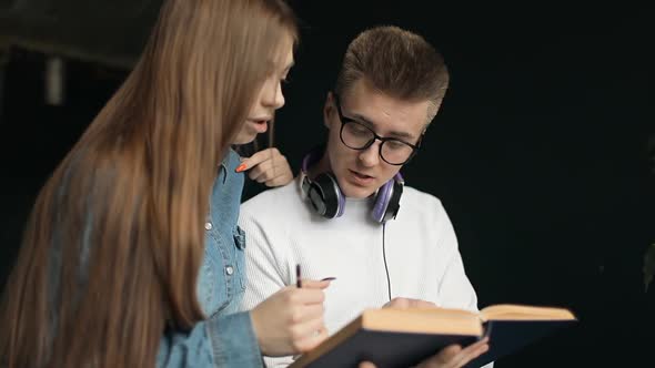 Young Students Having Discussion on Notes