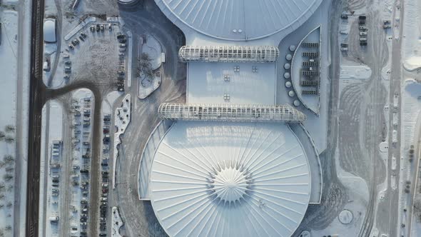 Top view in winter of a modern sports complex with parking in Minsk. Belarus