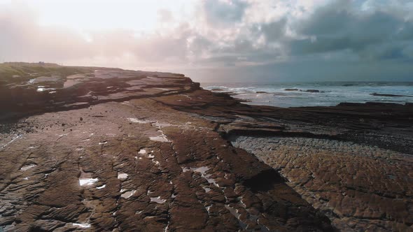 Low Flight Over the Rocky Bay of Kilkee at the Irish West Coast