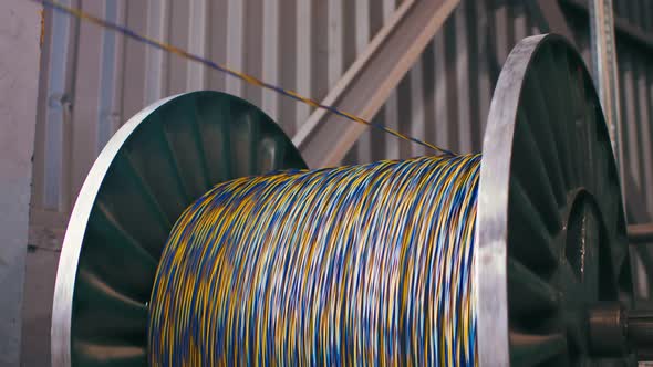 Spinning Reel with Cable in Cable Production Plant Closeup