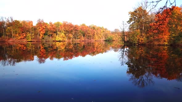 Aerial View. Flying over the beautiful autumn River. Aerial camera shot.