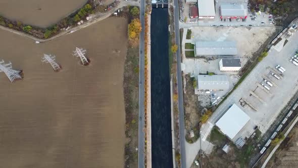 Industrial Zone And Dambovita River Near Bucharest In Romania, Aerial View