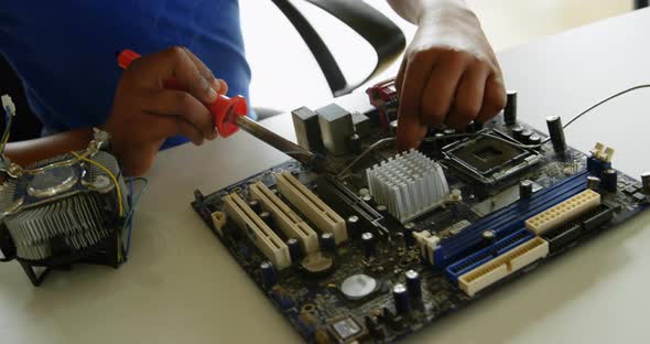 Girl Soldering a Circuit Board at Desk in Office 4k