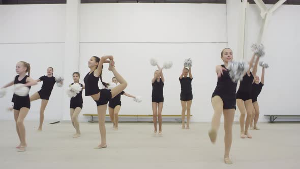 Group of Girls Showing Cheerleading Moves