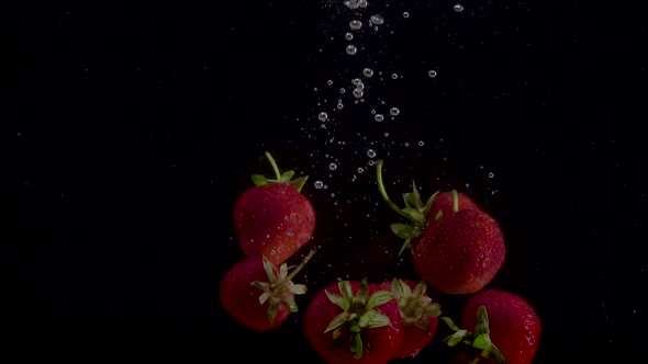 Strawberry Slow Motion Closeup Falling in Water