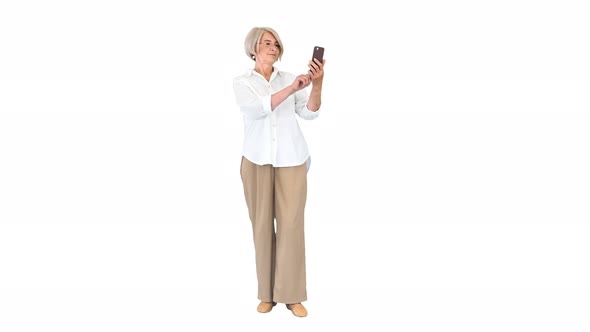 Intelligent Grandma Taking a Selfie on White Background