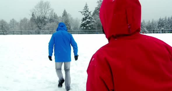 Couple playing with snowball