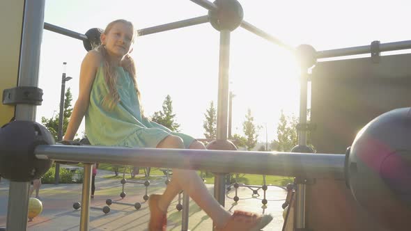 Child Girl Swinging The Legs 3