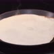 The Woman Turns the Pancake Over in the Pan - VideoHive Item for Sale