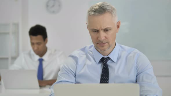 No, Grey Hair Businessman Shaking Head To Reject Plan