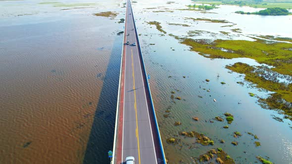 Drone video of the road leads through a large beautiful wetland.